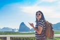 Young traveler woman find way direction with map on mobile phone