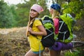 Young travelers with backpack in hill forest Freedom and travel concept