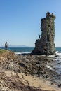Young travelers enjoying the ruins of a genoese tower on the coast of the Cap Corse, France.