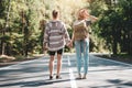 Young travelers hipsters couple holding hands and looking forward to a joint journey Royalty Free Stock Photo