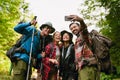 Young travelers taking selfie photo while hiking in forest Royalty Free Stock Photo