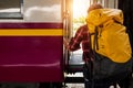 Young traveling backpacker on vacation at the train station, travel concept