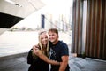 Young Traveling Couple Posing on Pier in Front of Ships and Sky Royalty Free Stock Photo