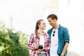 Young traveling couple: taking pictures of old town.