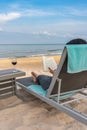 Traveller reading book with glass of wine on beautiful beach Royalty Free Stock Photo