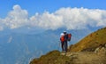 Young trekker looking at snow mountain