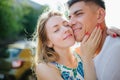 Young trendy beautiful couple dating outdoors in city