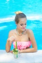 Young trendy blonde woman with a glass of refreshing lemonade Royalty Free Stock Photo