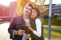 Young trendy couple listening music outdoor Royalty Free Stock Photo