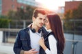 Young trendy couple in outdoor sunset
