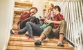 Young trendy friends drinking wine inside fashion winery bar - Happy millennials people having fun and laughing together in pub Royalty Free Stock Photo