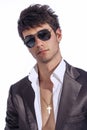 Young trendy guy. Italian man with sunglasses and open white shirt Royalty Free Stock Photo