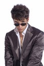 Young trendy guy. Italian man with sunglasses and open white shirt Royalty Free Stock Photo