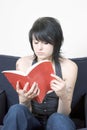 Young trendy woman reading a book Royalty Free Stock Photo