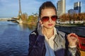 Young trendy woman talking on cell phone near Eiffel tower Royalty Free Stock Photo