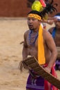 A Young tribal boy of Nagaland performing traditional folk dance on stage during Hornbill festival Royalty Free Stock Photo