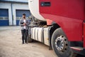 Young truck driver in casual clothes