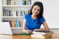 Young turkish female student at desk