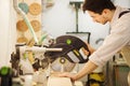 Young turner cuts board with circular saw