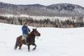 Young Tuva boy competing in a horse race competition in the Altai mountains in China