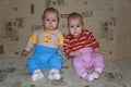 Young twins sitting on couch