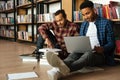 Young two african men reading books using laptop computer Royalty Free Stock Photo