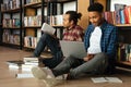 Young two african men students sitting in library Royalty Free Stock Photo