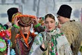 Young ukrainian man and woman perform Malanka song during ethnic festival in open-air museum of folk architecture,Bukovina