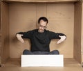 Young unemployed man holding a white board, a place for advertising, the idea of a cry for help Royalty Free Stock Photo