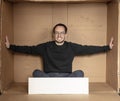 Young unemployed man holding a white board, a place for advertising, the idea of a cry for help Royalty Free Stock Photo