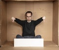 Young unemployed man holding a white board, a place for advertising, the idea of a cry for help Royalty Free Stock Photo