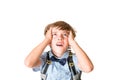 Young unhappy boy holding his head, looking up Royalty Free Stock Photo