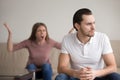 Young unhappy couple quarrelling, upset thoughtful husband, hyst Royalty Free Stock Photo