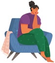 Young unhappy woman dressed in casual clothes sitting in chair. Female sad character at home