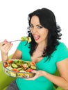 Young Unhappy Woman Eating a Fresh Crisp Mixed Garden Salad Royalty Free Stock Photo