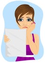 Young unhappy woman reading a letter with bad news