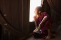 Young unidentified Buddhist monk learning in the Shwe Yan Pyay monastery school