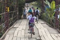 Young unidentified girl cycling back from school Royalty Free Stock Photo