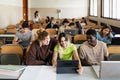 Young university students listening lesson in classroom Royalty Free Stock Photo