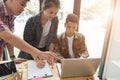 young university students studying with computer in cafe. Group Royalty Free Stock Photo