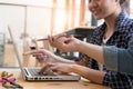 young university students studying with computer in cafe. Group Royalty Free Stock Photo