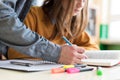 Young unrecognisable teacher helping his student in class. Education and Tutoring. Royalty Free Stock Photo