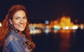 Young urban redhead woman portrait at night