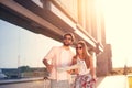 Urban tourist couple with sunlight