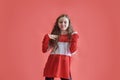 Young urban woman dancing on red background, modern slim hip-hop style teenage girl Royalty Free Stock Photo