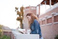 Young urban woman reading book outoors Royalty Free Stock Photo