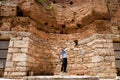 Young Uruguayan tourist posing by the concave wall of Ancient Celsus Library at Ephesus, Turkey Royalty Free Stock Photo