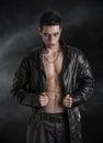 Young Vampire Man in an Open Black Leather Jacket Royalty Free Stock Photo