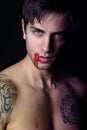 Young Vampire Whith Blood Flowing Lips