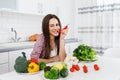 Young Vegetarian Girl Biting a Chili Pepper and Winking Royalty Free Stock Photo